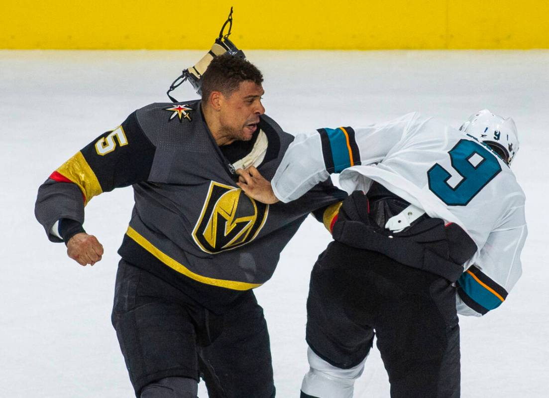 Golden Knights right wing Ryan Reaves (75) fights with San Jose Sharks left wing Evander Kane ( ...