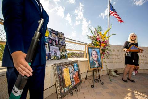 Retired Palo Verde High School teacher Gail Fahy holds an American flag after a ceremony honori ...