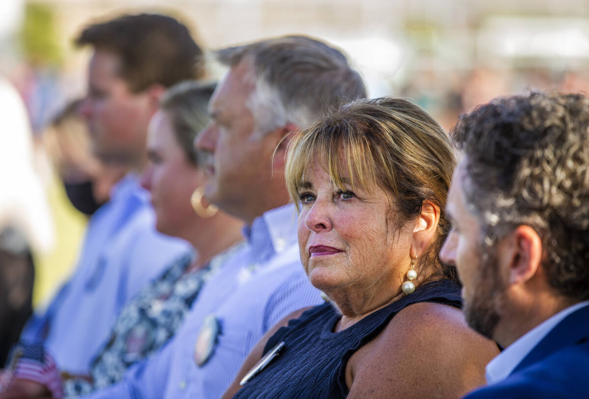 Francine Edwards, center, with Brad Edwards, tears up while listening to music being played dur ...