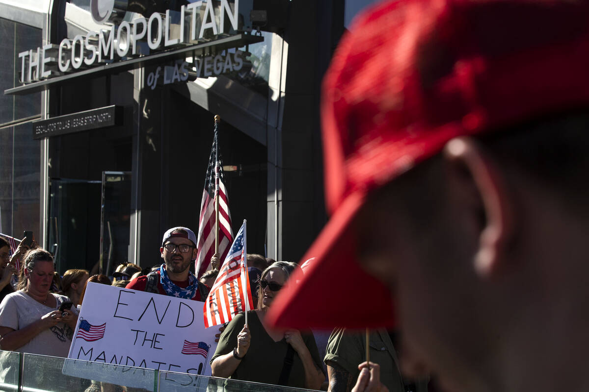 Protesters demonstrate outside of The Cosmopolitan during an anti-mask, anti-vaccination and fr ...