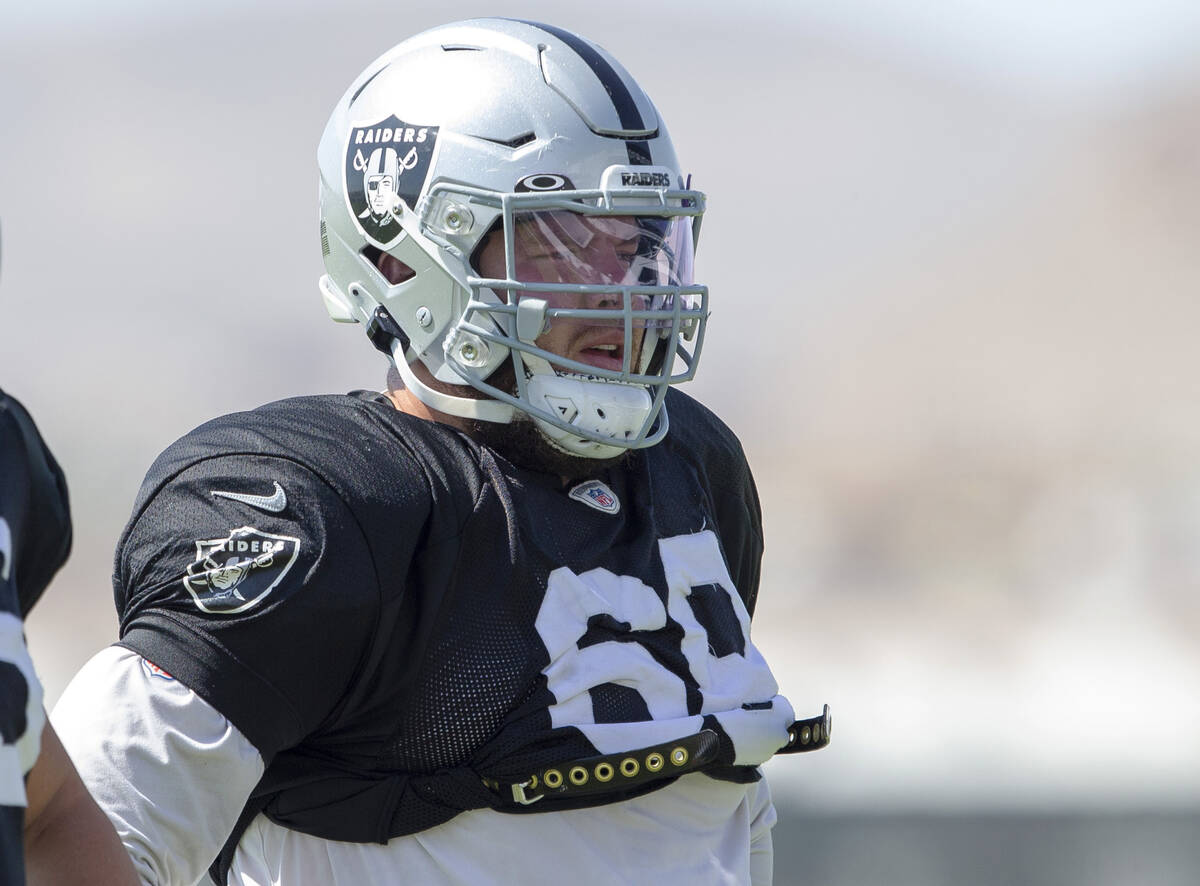 Raiders centers Nick Martin (66) and Andre James (68) look on during team practice at the Raide ...
