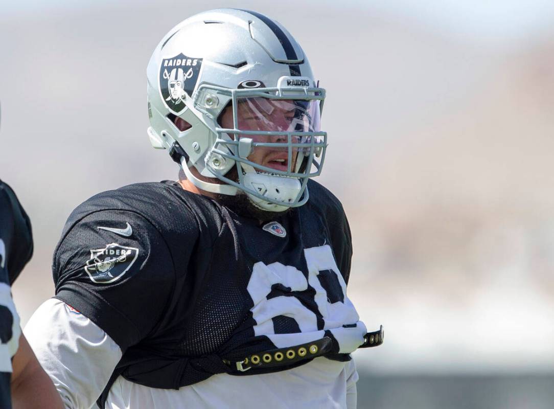 Raiders centers Nick Martin (66) and Andre James (68) look on during team practice at the Raide ...