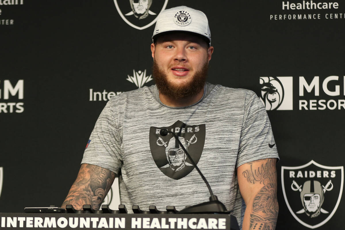 Raiders center Andre James (68) answers questions at a news conference at the Raiders Headquart ...