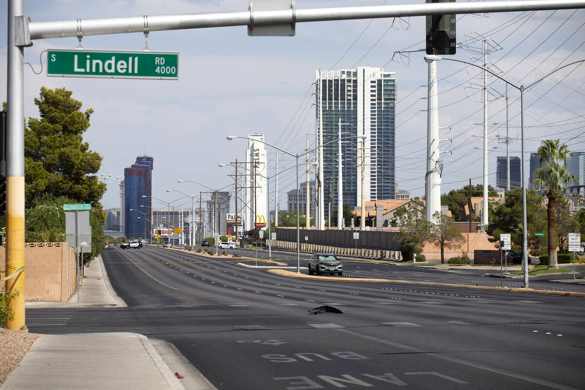 Las Vegas police respond to the scene of a fatal car accident at the intersection of West Flami ...