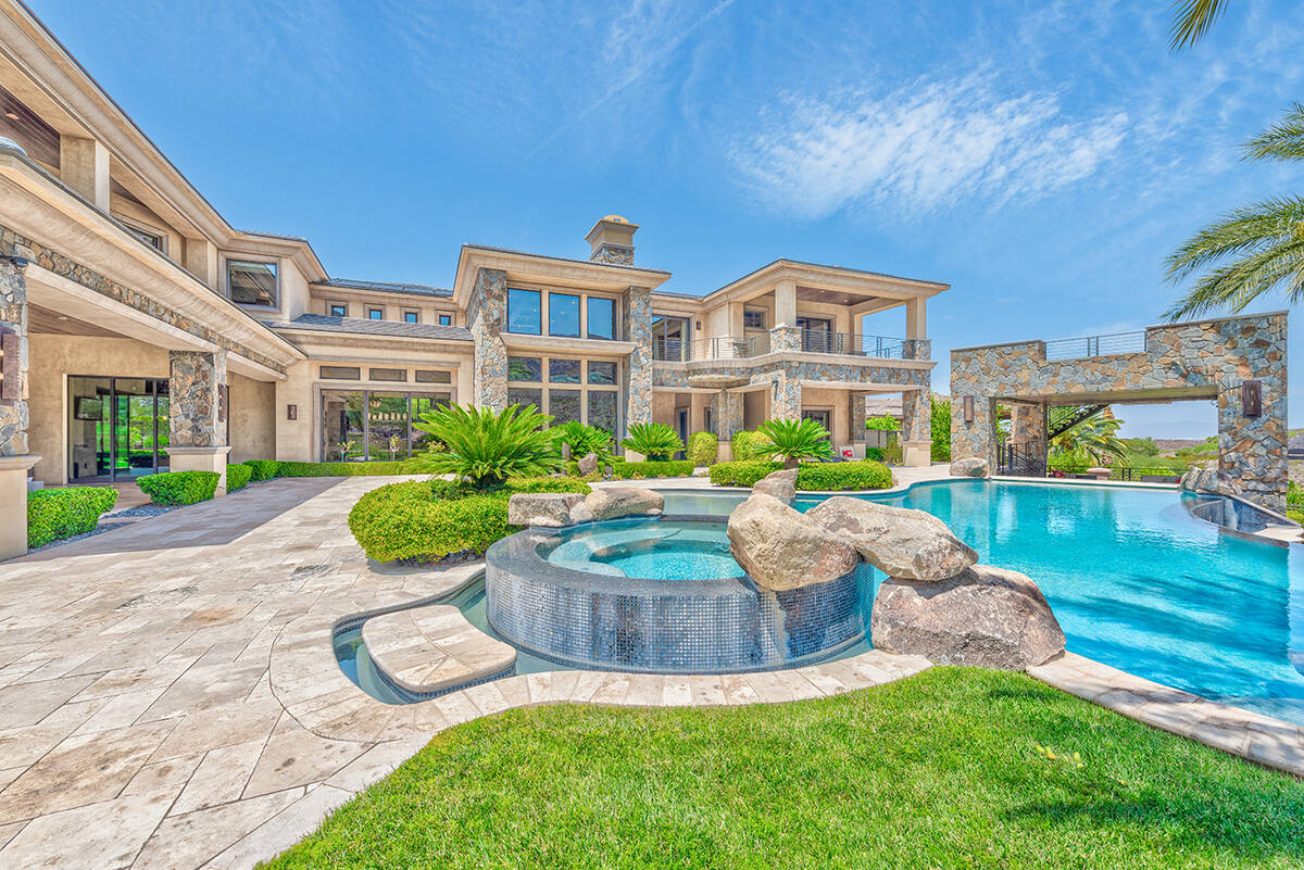BHHS This 10,205-square-foot home at 596 St. Croix St. in MacDonald Highlands, a luxury master- ...