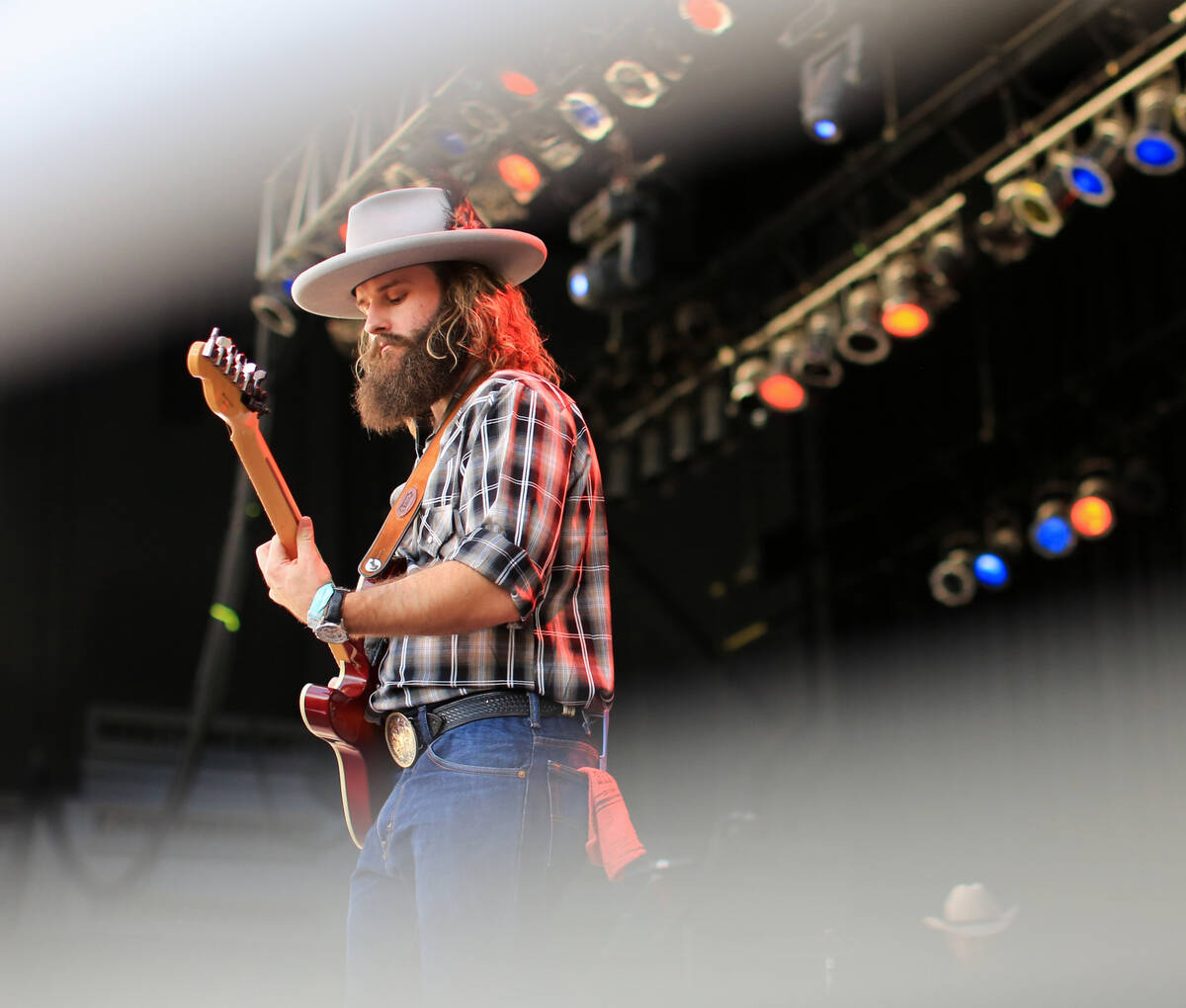 Chase Nutter plays lead guitar with The Rhyolite Sound at the Country 58 Benefit Concert, to he ...