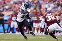 Baltimore Ravens running back Ty'Son Williams (34) runs with the ball as Washington Football Te ...