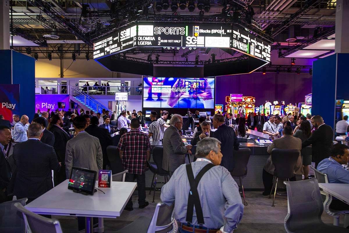 The bar is in full swing within the Scientific Games Corporation exhibition space during the Gl ...