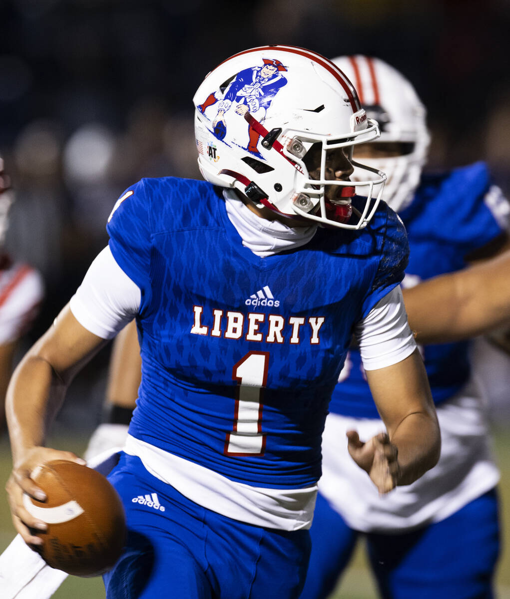 Liberty quarterback Jayden Maiava (1) runs with the ball against Mater Dei during the first qua ...