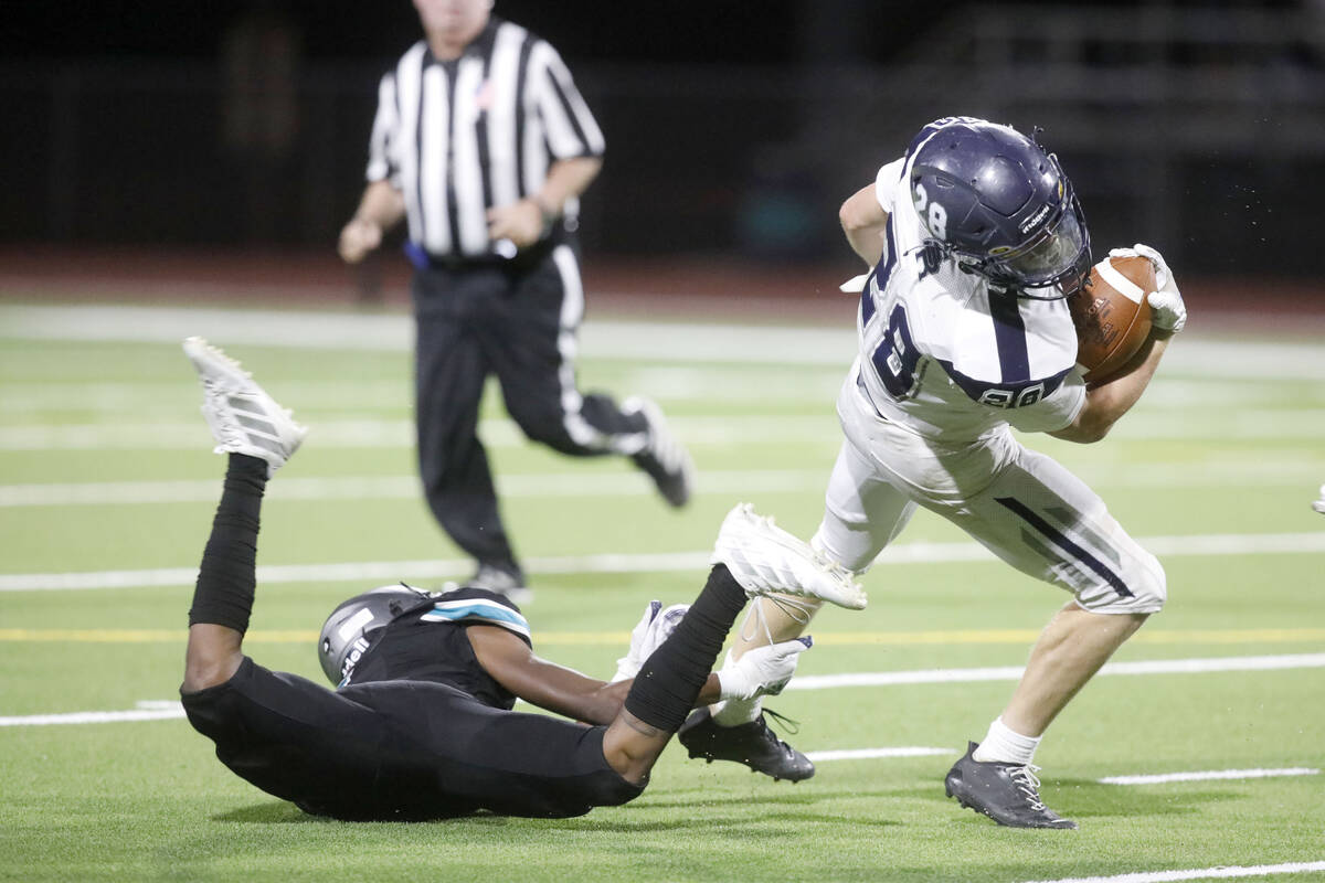 Shadow Ridge High School's Dylan Wood (28) keeps a ball away from Silverado High School's Shyn ...