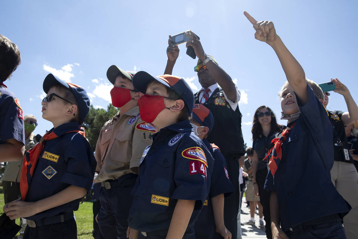 A group of Boy Scouts watches as balloons are released in honor of first responders who died in ...