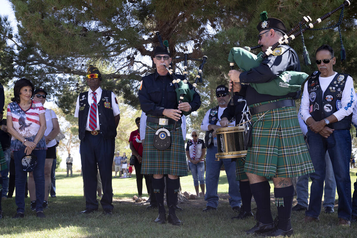 Members of the Las Vegas Emerald Society play taps on the bagpipes during a Sept. 11 remembranc ...