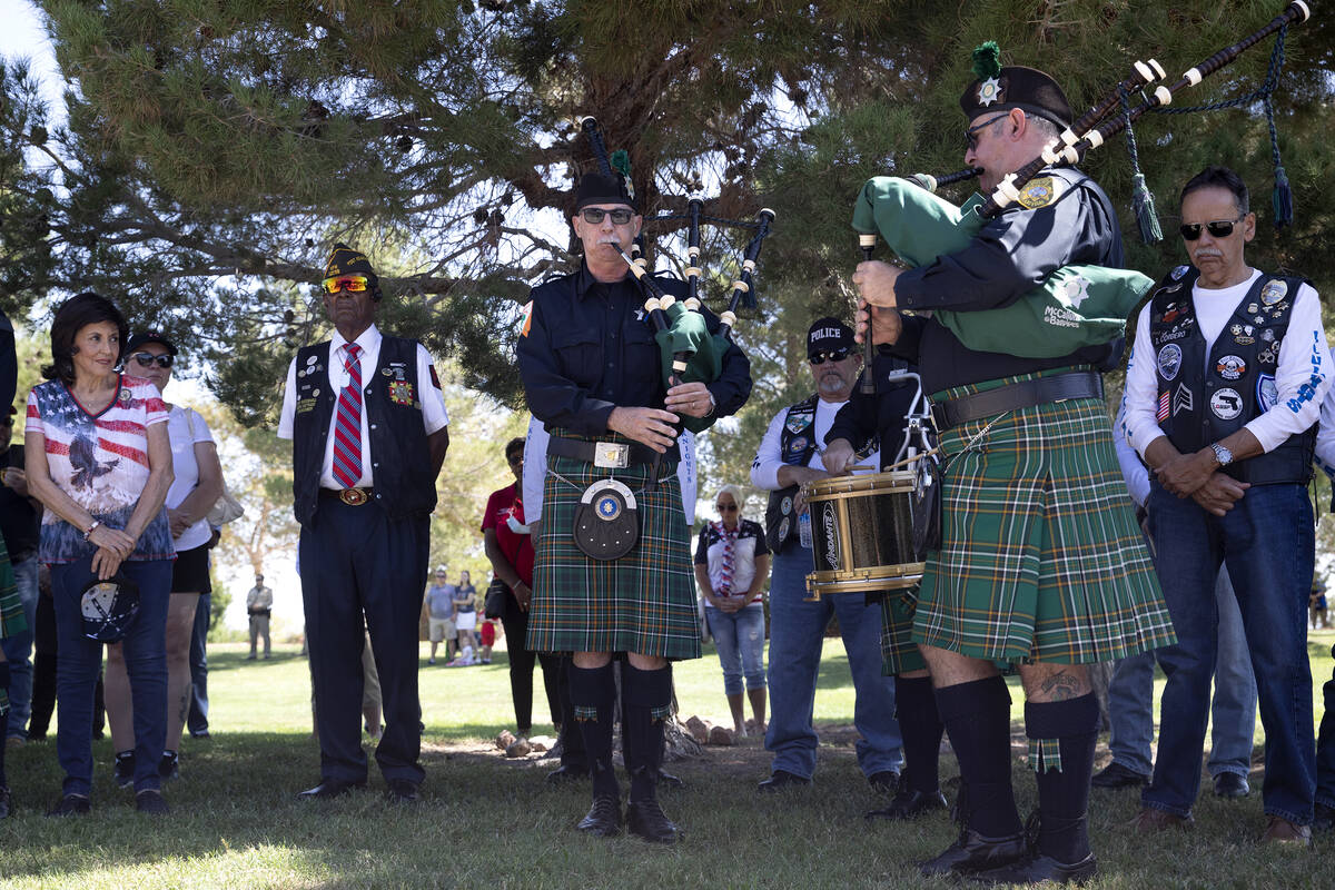 Members of the Las Vegas Emerald Society play taps on the bagpipes during a Sept. 11 remembranc ...