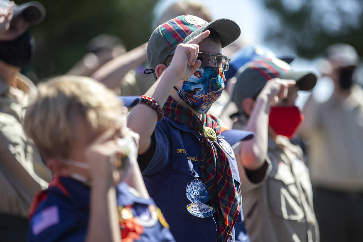 A group of Boy Scouts salutes as the national anthem is sung during a Sept. 11 remembrance even ...