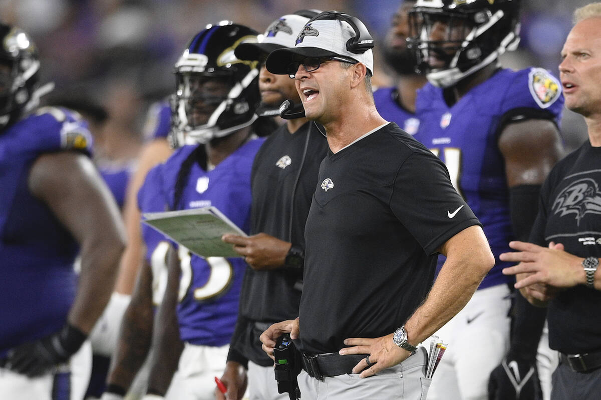 Baltimore Ravens head coach John Harbaugh reacts during the first half of an NFL preseason foot ...