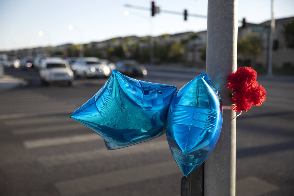 A memorial with balloons and flowers is seen at intersection of West Robindale Road and South D ...