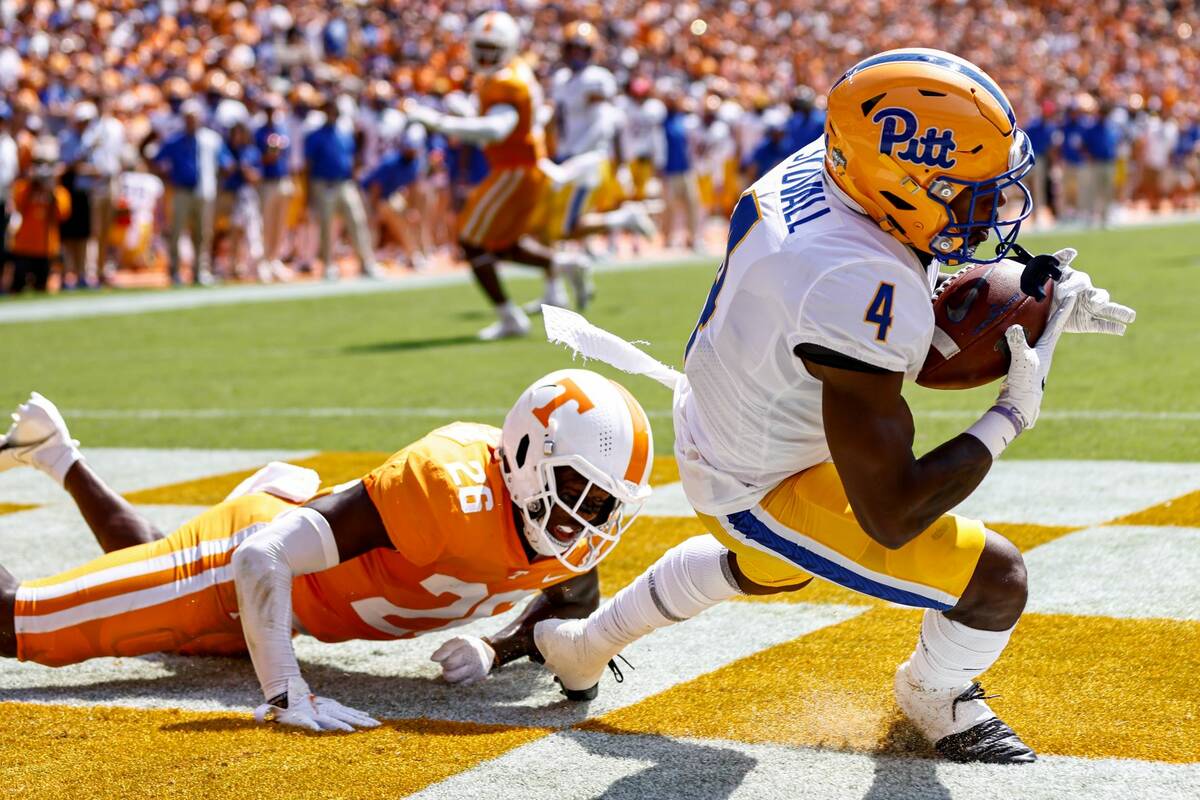 Pittsburgh wide receiver Melquise Stovall (4) catches a touchdown pass in front of Tennessee de ...