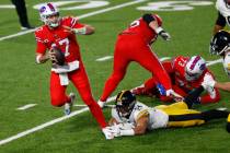 Buffalo Bills quarterback Josh Allen (17) is forced out of the pocket by Pittsburgh Steelers li ...