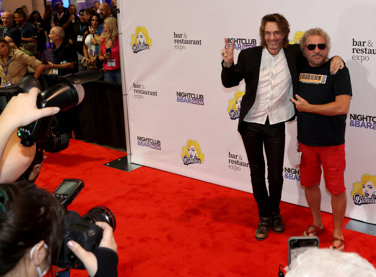 Rick Springfield, left, and Sammy Hagar walk the red carpet as the show floor opens for the Nig ...