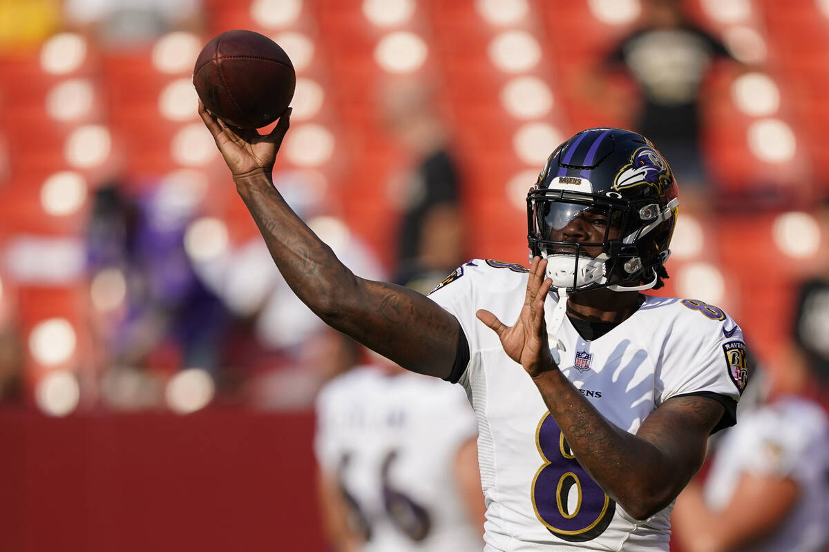 Baltimore Ravens quarterback Lamar Jackson (8) throws during warmups before a preseason NFL foo ...