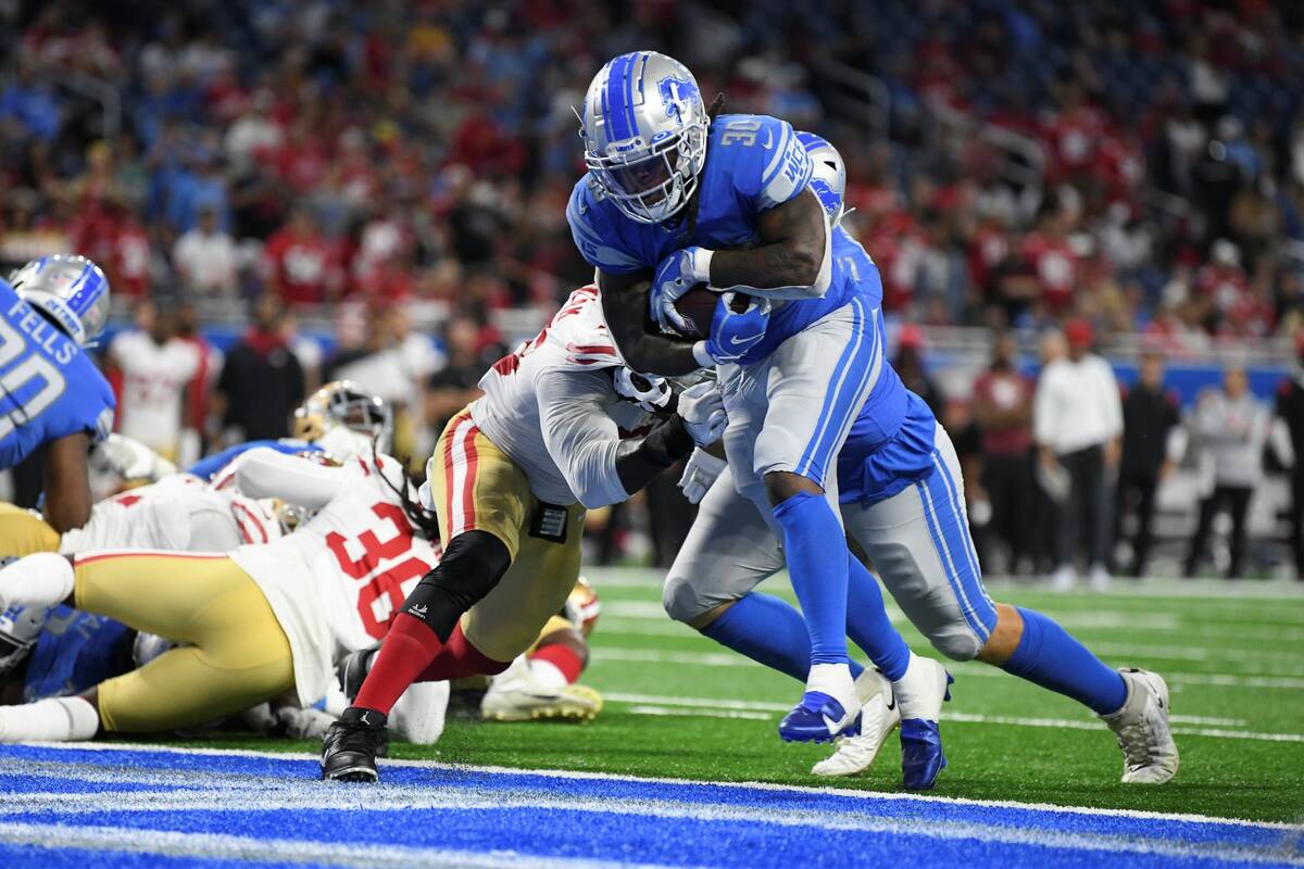Detroit Lions running back Jamaal Williams (30) runs for a one-yard touchdown against the San F ...