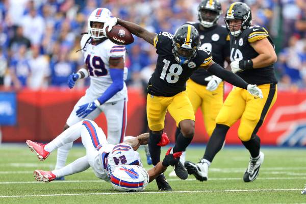Pittsburgh Steelers wide receiver Diontae Johnson (18) is tackled by Buffalo Bills cornerback T ...