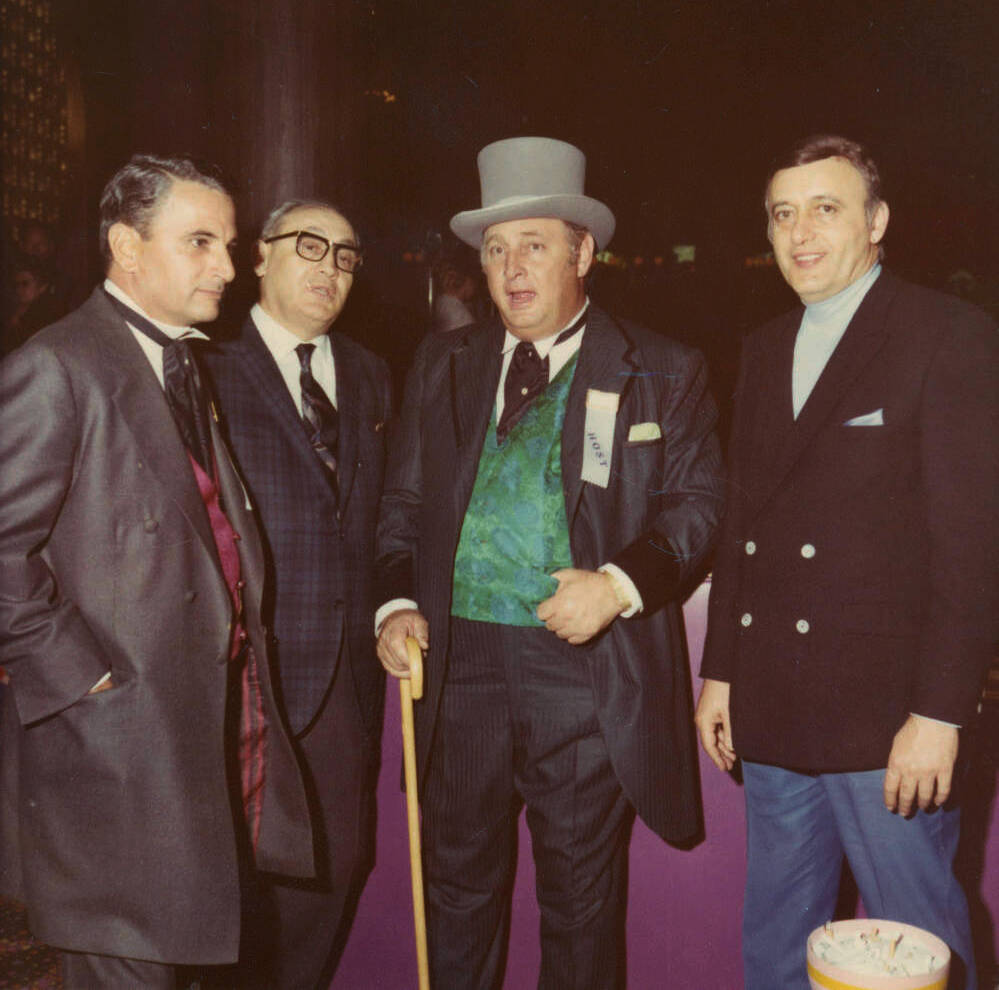 Photograph of Stan Mallin, Herman Sarno, Jay Sarno, and an unidentified man at the opening of C ...