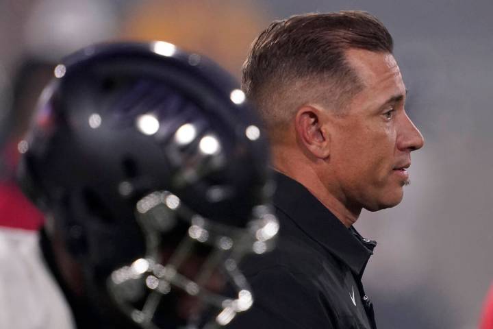 UNLV head coach Marcus Arroyo watches his team prior to an NCAA college football game against A ...