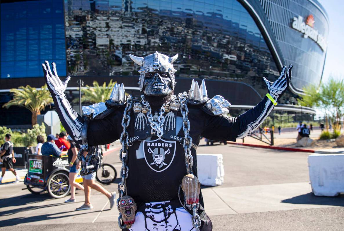 Brian McComb, of Washington, poses for a picture before an NFL game between the Raiders and the ...