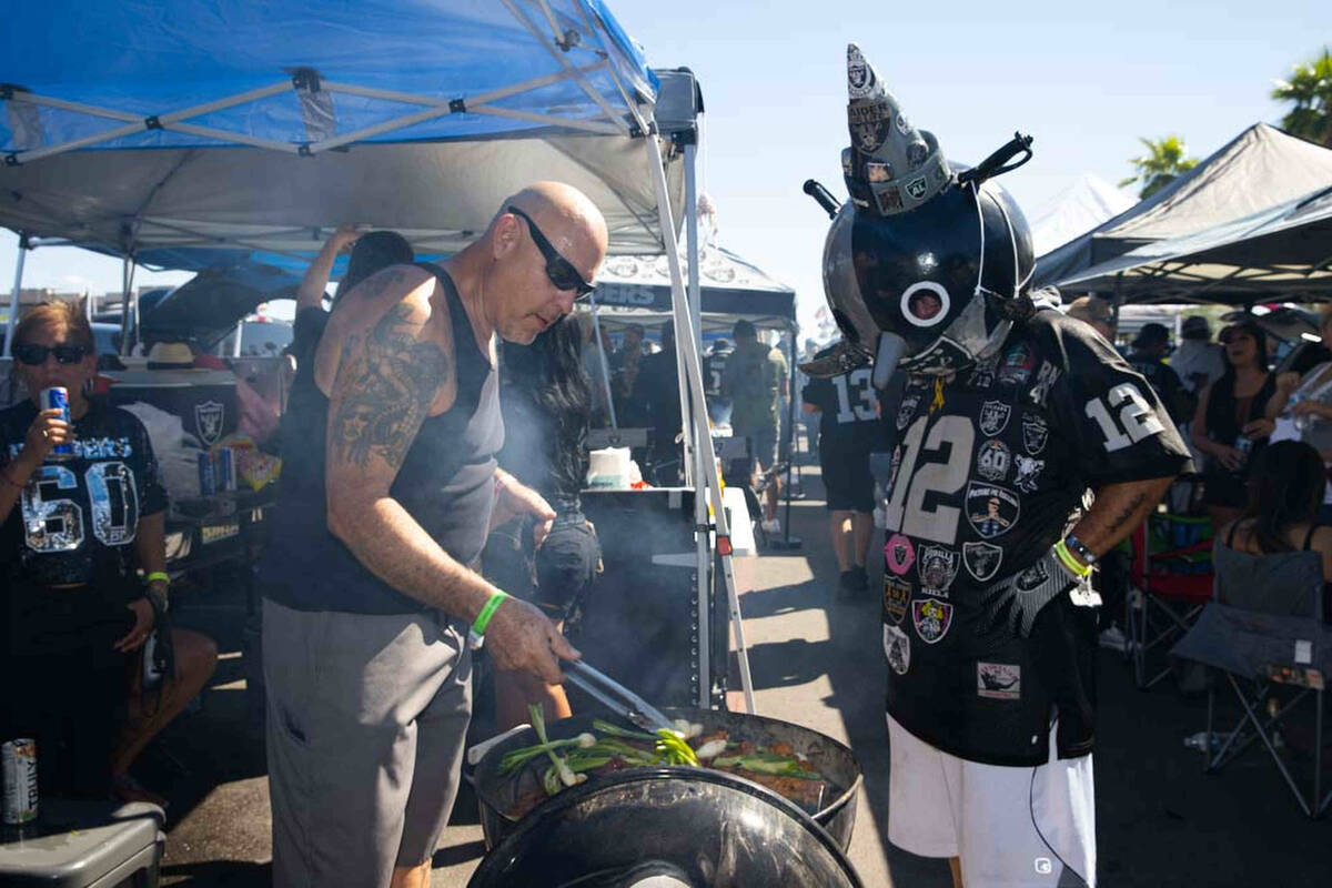 Joe Gomez and Raider Jack tailgate before an NFL football game between the Raiders and Baltimor ...