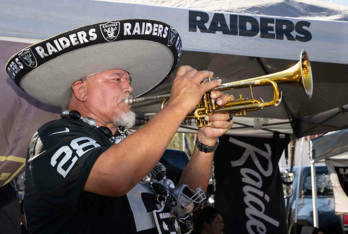 Tony Valdivia, of Stockton, CA, performs at a tailgate party before an NFL football game betwee ...