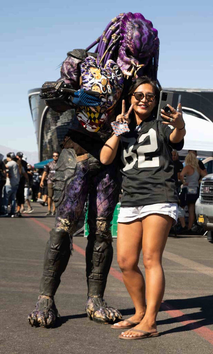Raidertor with Yumi Yamaato, of Las Vegas, tailgate before an NFL football game between the Rai ...
