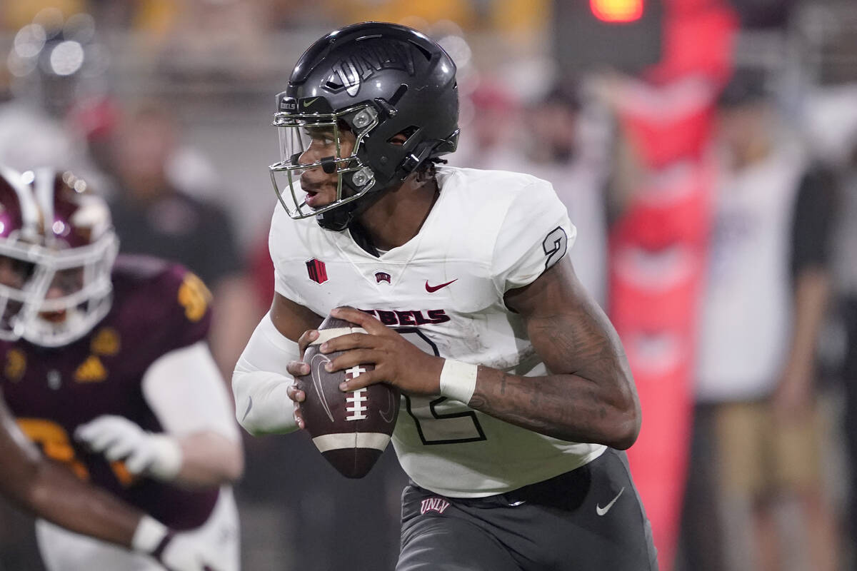 UNLV quarterback Doug Brumfield (2) looks to throw against Arizona State during the first half ...