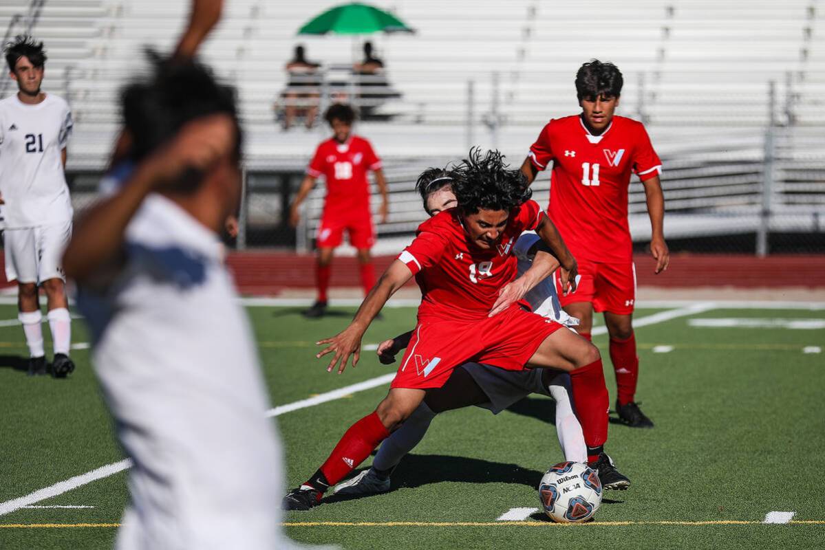 Westernճ Joshua Rodriguez (19) steals the ball from Shadow Ridgeճ midfielder Joaqui ...