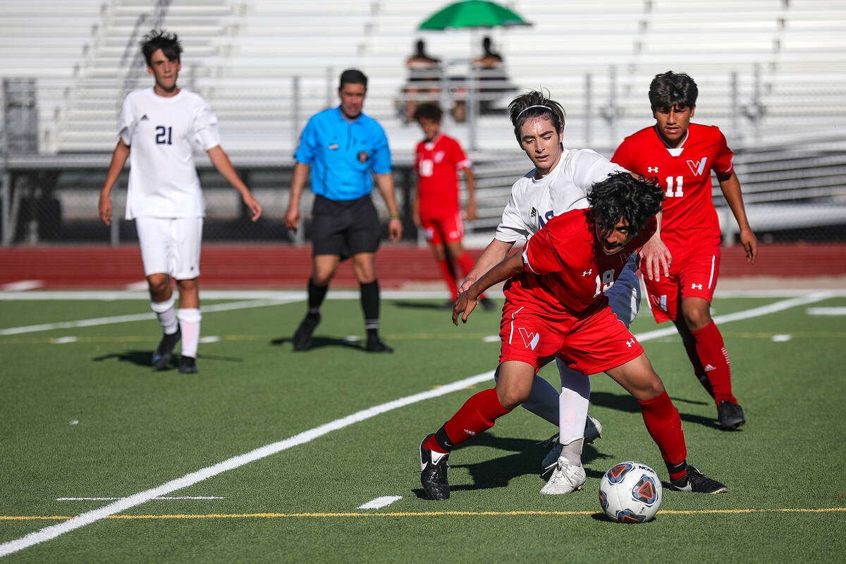 Westernճ Joshua Rodriguez (19) steals the ball from Shadow Ridgeճ midfielder Joaqui ...