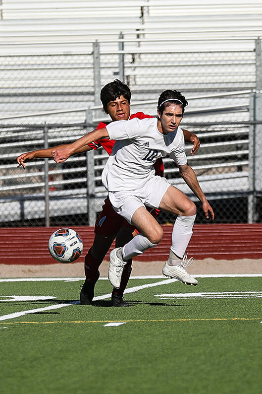 Shadow Ridgeճ midfielder Joaquin Gomez (10) blocks the ball from Westernճ Elijah Es ...