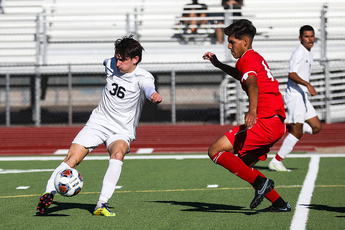 Shadow Ridgeճ Ian Martinez (36) dribbles past Westernճ Sebastian Aldama (4) during ...