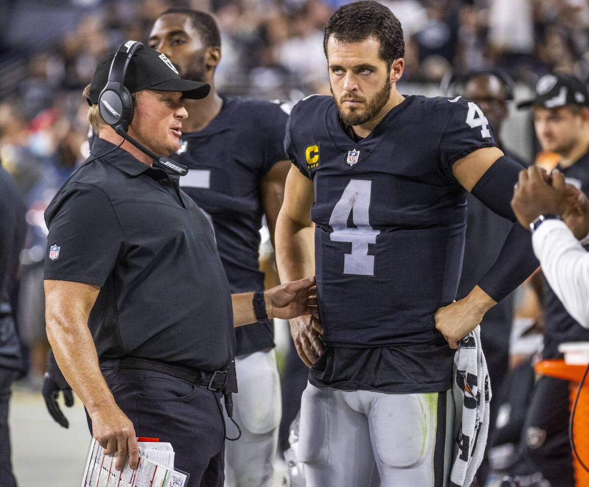 Raiders Head Coach John Gruden has a serious conversation with Raiders quarterback Derek Carr ( ...