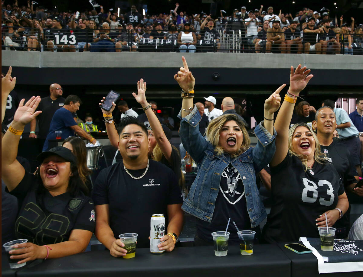 Raiders fans cheers before an NFL football game against the Baltimore Ravens at Allegiant Stadi ...