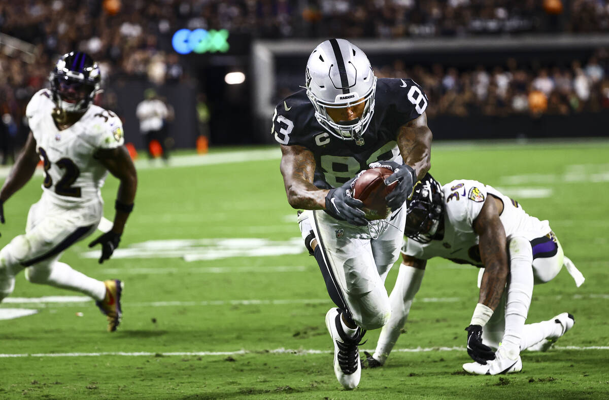 Raiders tight end Darren Waller (83) scores a touchdown to tie the game against the Baltimore R ...