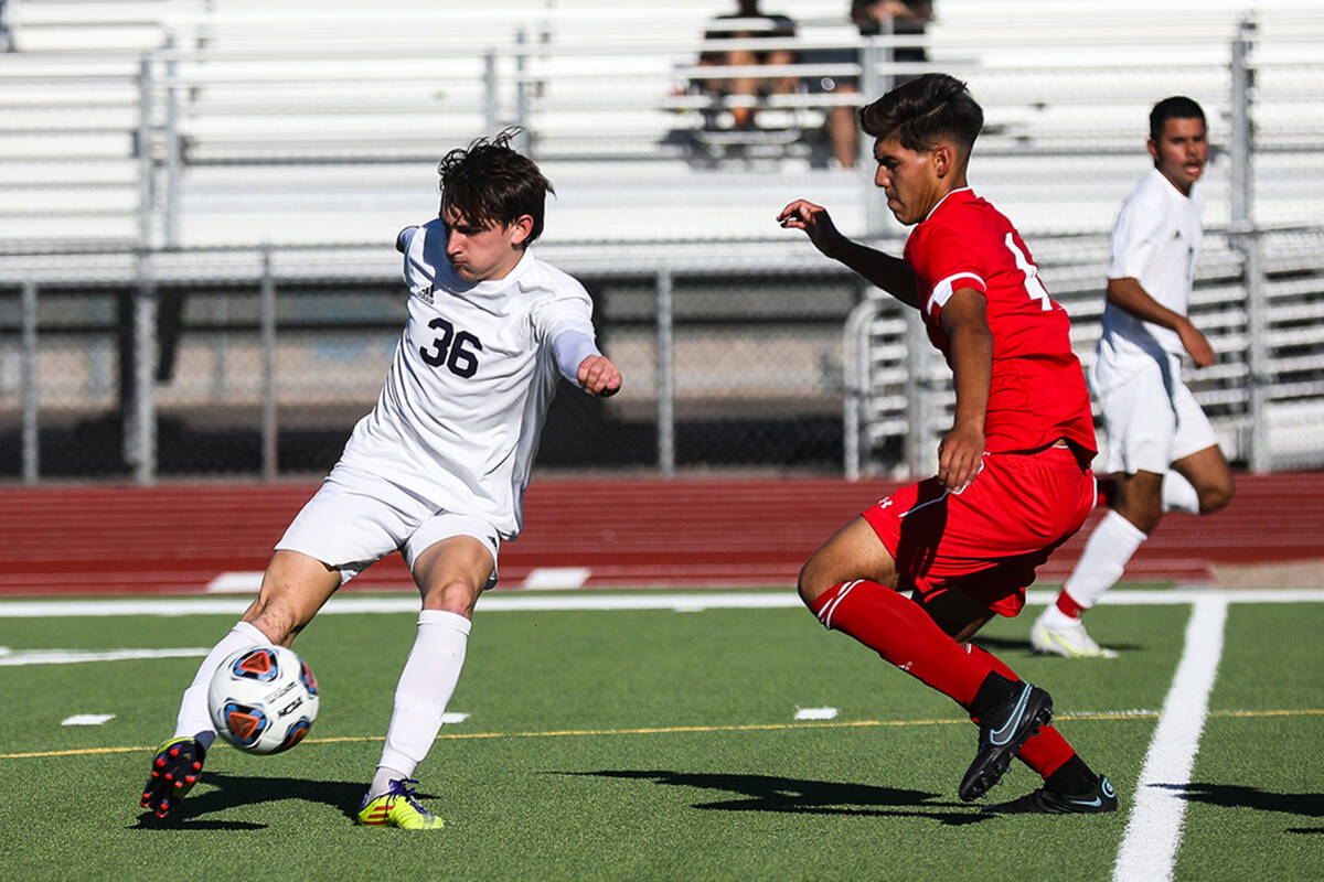 Shadow Ridge's Ian Martinez (36) dribbles past Western's Sebastian Aldama (4) during a game on ...