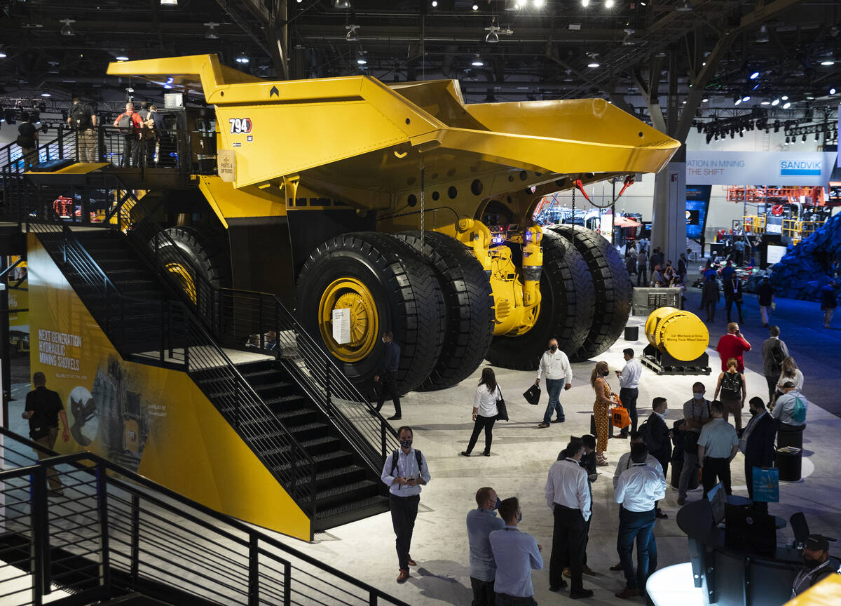 CAT 794 AC mining truck is displayed at Caterpillar booth during the opening day of the Nationa ...