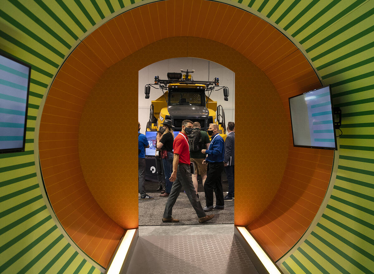 Expogoers check out Bell B45E dump truck during the opening day of the National Mining Associat ...
