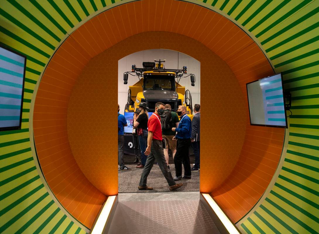 Expogoers check out Bell B45E dump truck during the opening day of the National Mining Associat ...