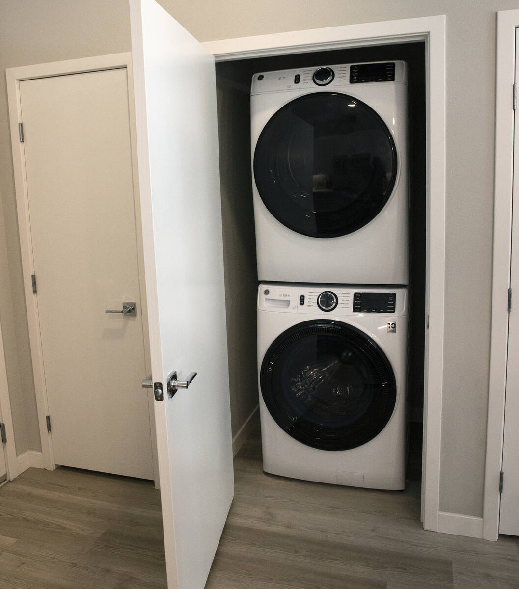 A laundry room is seen in a one-bedroom apartment at Auric Symphony Park, the first luxury mult ...