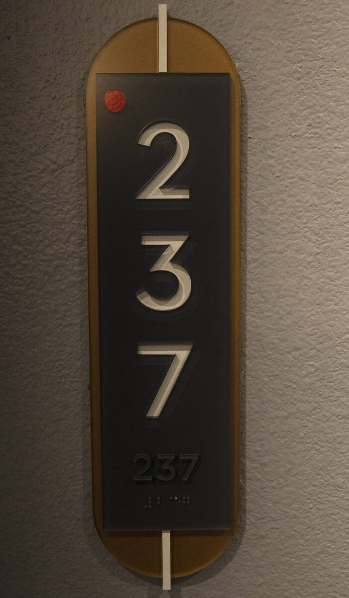 Room number sign is seen outside a one-bedroom apartment at Auric Symphony Park, the first luxu ...