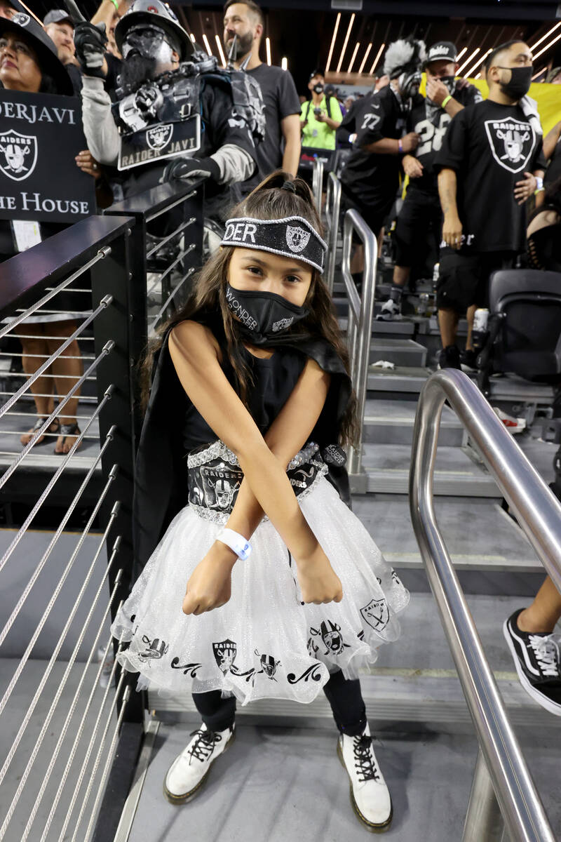 Fans, including Jocelyn Lopeman, 6, of Fontana, Calif. cheer as the Raiders take on the Baltimo ...