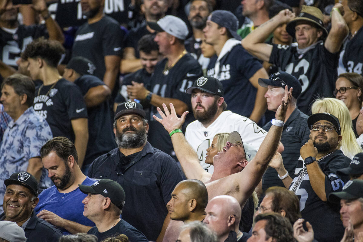 Raiders fans celebrate another score over the Baltimore Ravens during the fourth quarter of the ...
