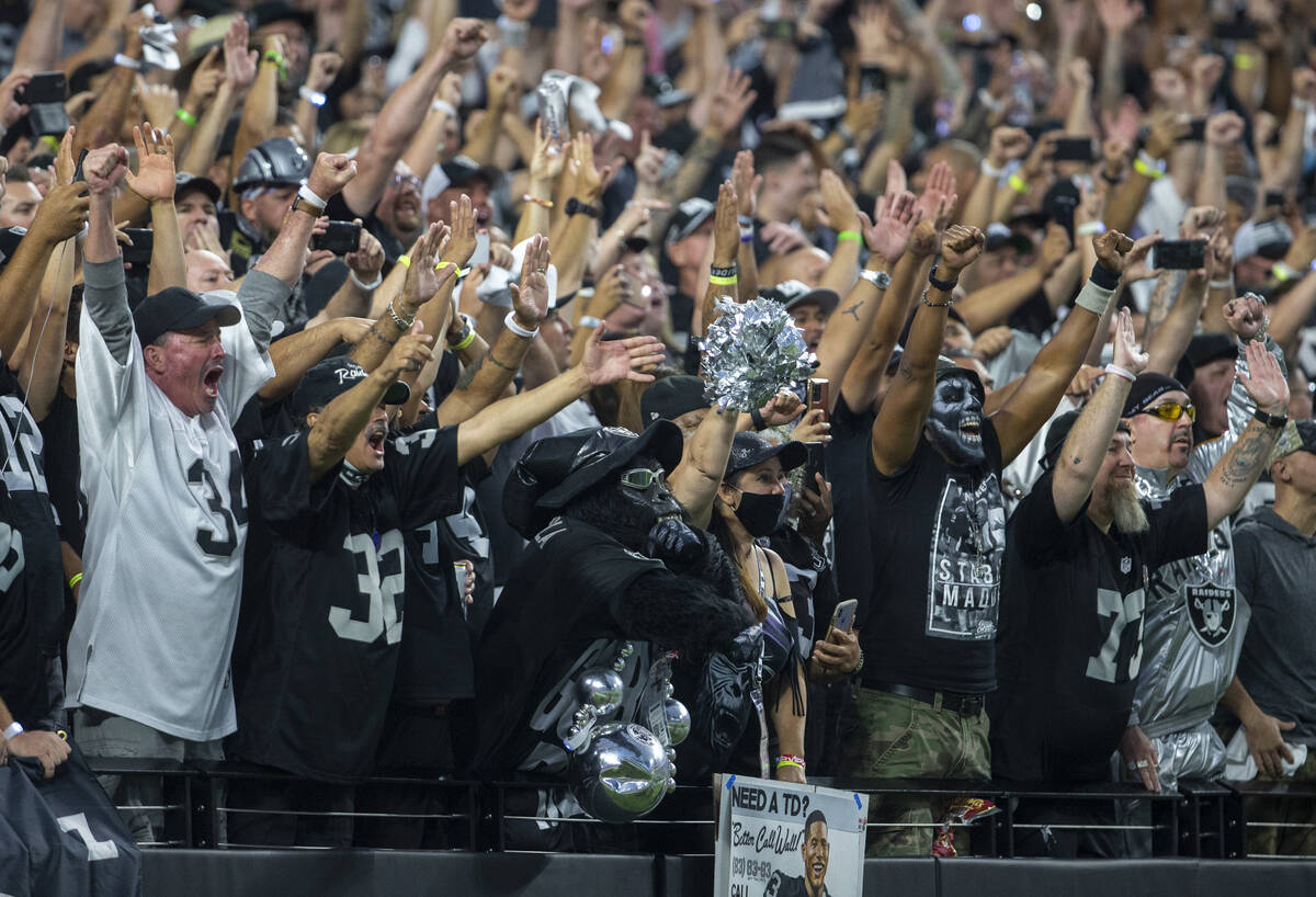 Raiders fans react after Josh Jacobs scores the Raiders’ first touchdown of the game dur ...