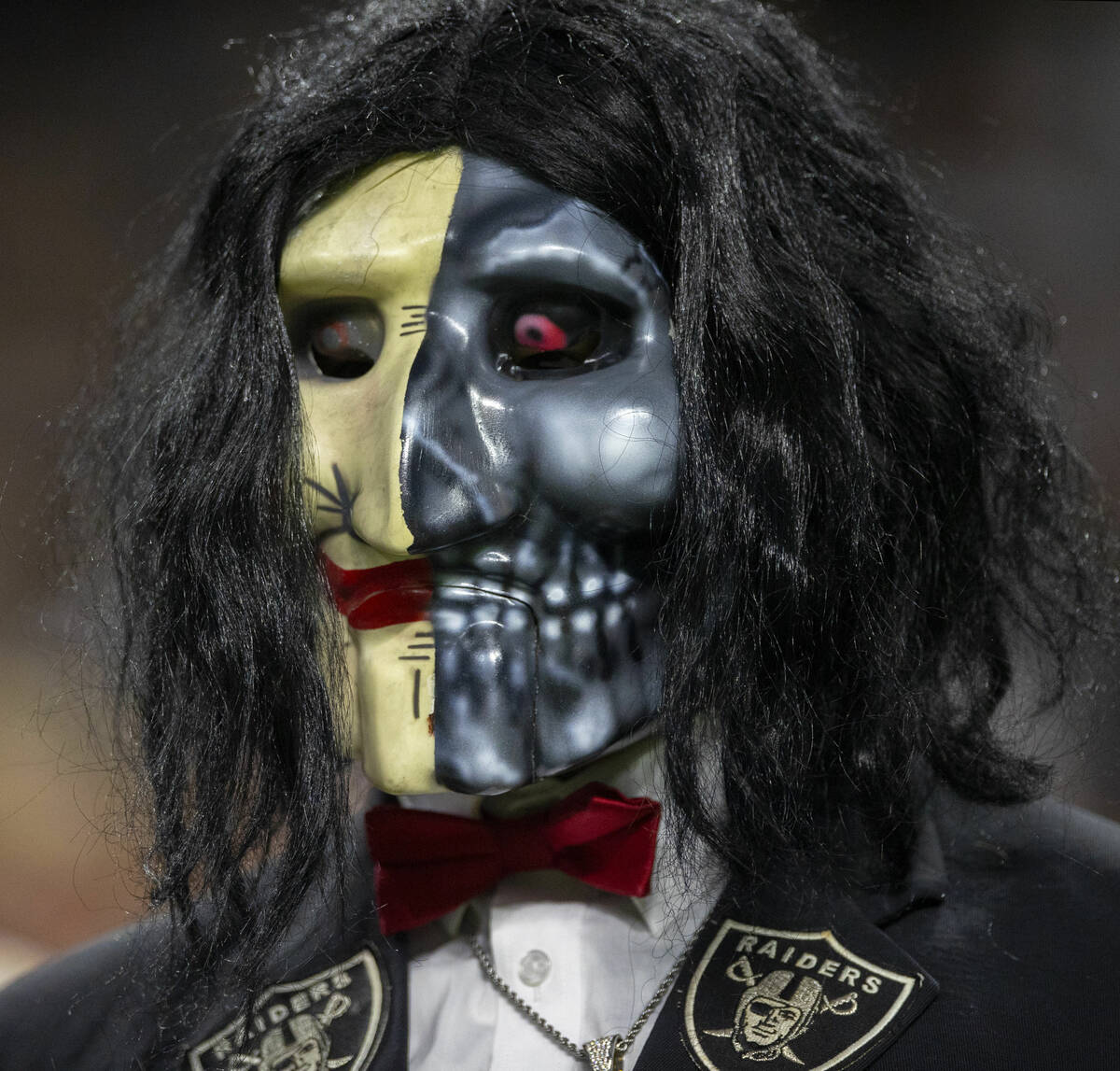 A Raiders fan during an NFL football game between the Raiders and Baltimore Ravens at Allegiant ...